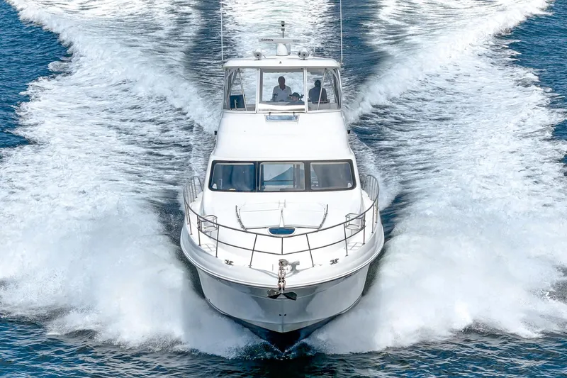 Slide: The Image of 2008 Sea Ray 58 Sedan Bridge yacht cruising on open water. - 10