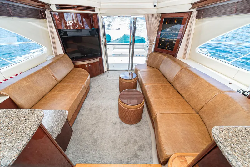 Slide: The Image of Luxurious interior of 2008 Sea Ray 58 Sedan Bridge yacht with leather seating and ocean view. - 25