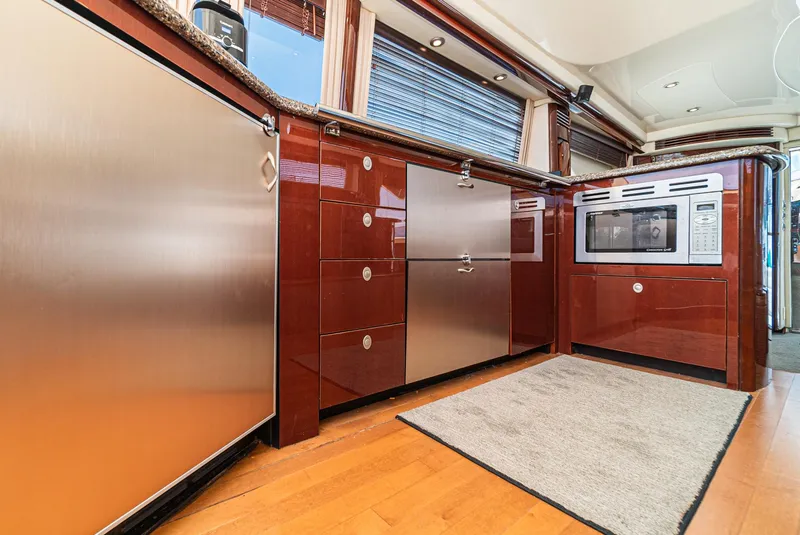 Slide: The Image of Luxurious kitchen interior of 2008 Sea Ray 58 Sedan Bridge yacht with modern appliances. - 29