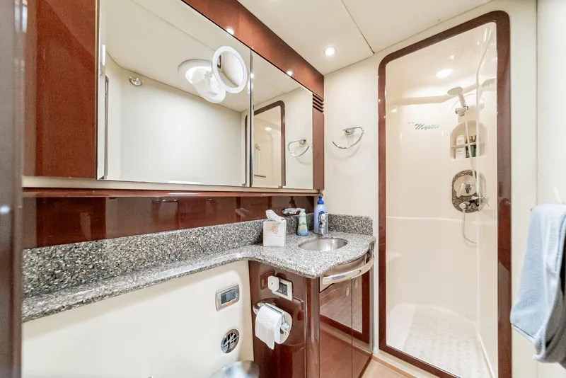 Slide: The Image of Luxurious bathroom in 2008 Sea Ray 58 Sedan Bridge yacht with granite countertop and shower. - 33