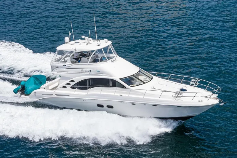 Slide: The Image of 2008 Sea Ray 58 Sedan Bridge yacht cruising on open water. - 5