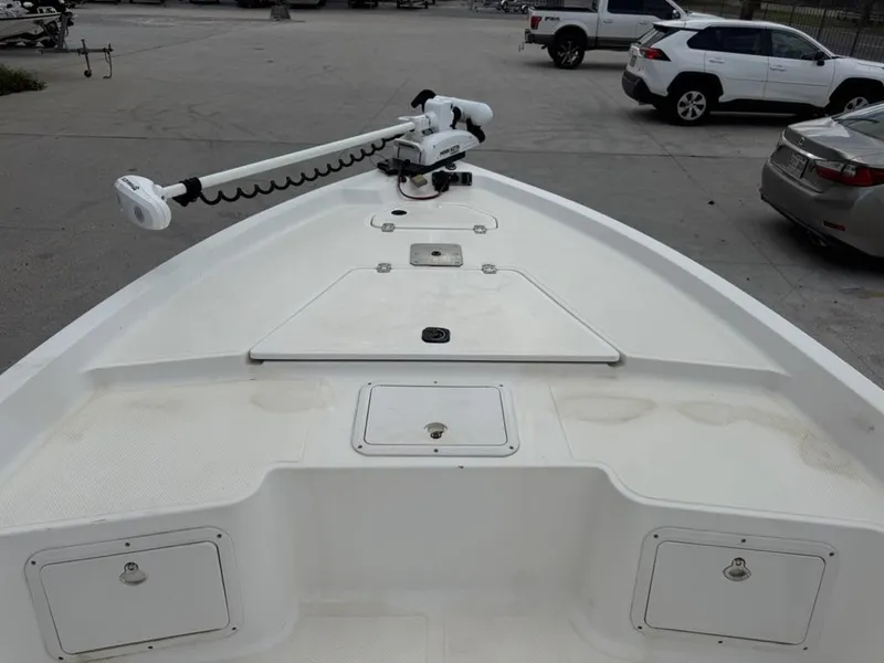 Slide: The Image of 2001 Key West 196 Bay Reef boat deck with trolling motor in parking lot. - 10