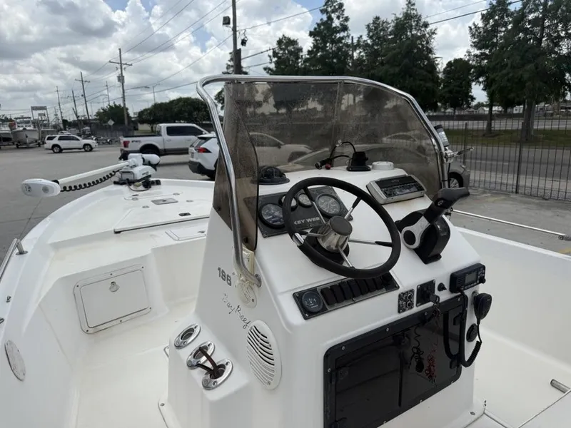 Slide: The Image of 2001 Key West 196 Bay Reef boat dashboard with steering wheel and controls. - 8