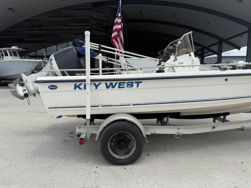 Slide: The Image of Key West 196 Bay Reef boat on trailer, 2001 model, with American flag. - 9