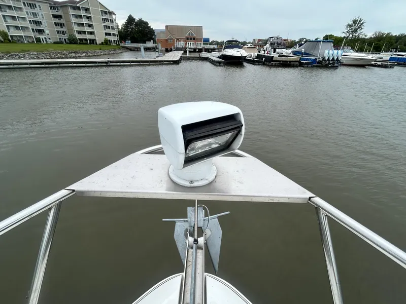 Slide: The Image of Bow view of 2006 Cruisers Yachts 300 Express at marina dock. - 15