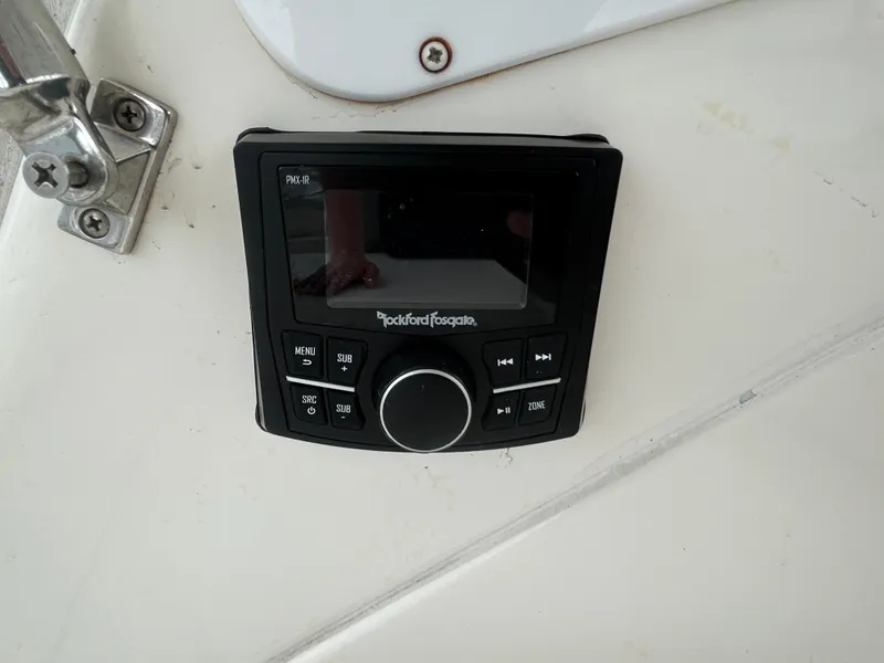 Slide: The Image of Rockford Fosgate audio control panel on 2006 Cruisers Yachts 300 Express. - 25