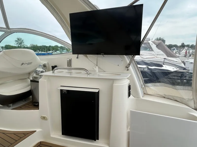 Slide: The Image of 2006 Cruisers Yachts 300 Express interior with TV and seating area. - 26