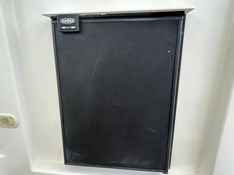 Slide: The Image of 2006 Cruisers Yachts 300 Express, black panel, integrated refrigerator. - 27