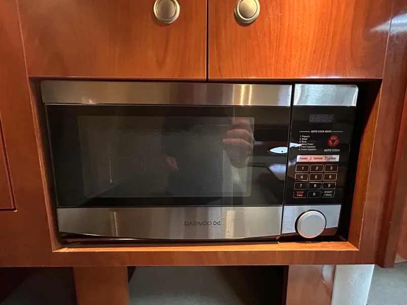 Slide: The Image of Built-in microwave in 2006 Cruisers Yachts 300 Express kitchen area. - 46