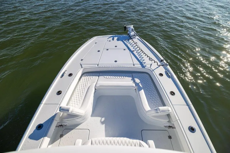Slide: The Image of 2024 Freeman 28 boat deck with seating, on calm water. - 4