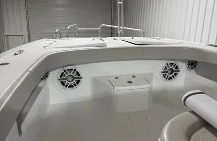 Slide: The Image of Interior view of a 2022 Freeman 43 boat, featuring speakers and seating. - 4