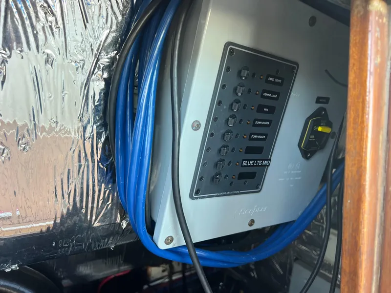 Slide: The Image of Engine room of 1986 Bayliner 3870 Motoryacht with visible wiring and components. - 29