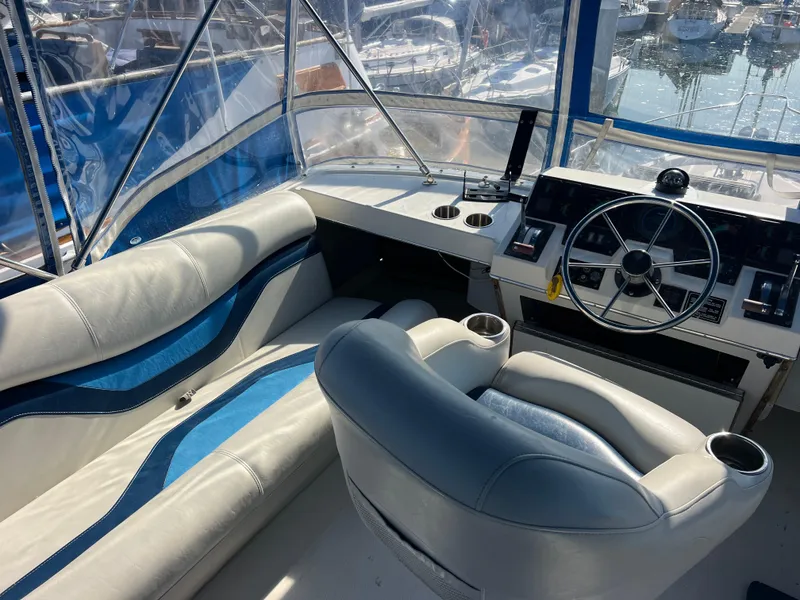 Slide: The Image of Engine room of a 1986 Bayliner 3870 Motoryacht, showcasing mechanical components and wiring. - 32