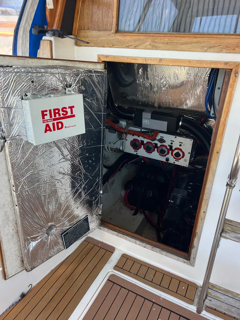 Slide: The Image of 1986 Bayliner 3870 Motoryacht deck with lifebuoy, docked at marina. - 34