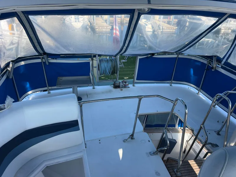 Slide: The Image of 1986 Bayliner 3870 Motoryacht deck with seating and stainless steel railings. - 36