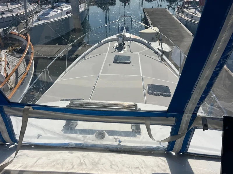 Slide: The Image of 1986 Bayliner 3870 Motoryacht cockpit with blue canopy and seating area. - 37