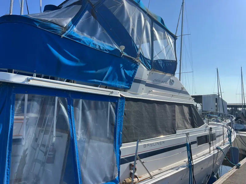 Slide: The Image of 1986 Bayliner 3870 Motoryacht docked at marina, viewed from cockpit. - 41