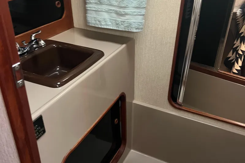 Slide: The Image of 1986 Bayliner 3870 Motoryacht cockpit with blue trim and navigation equipment. - 46