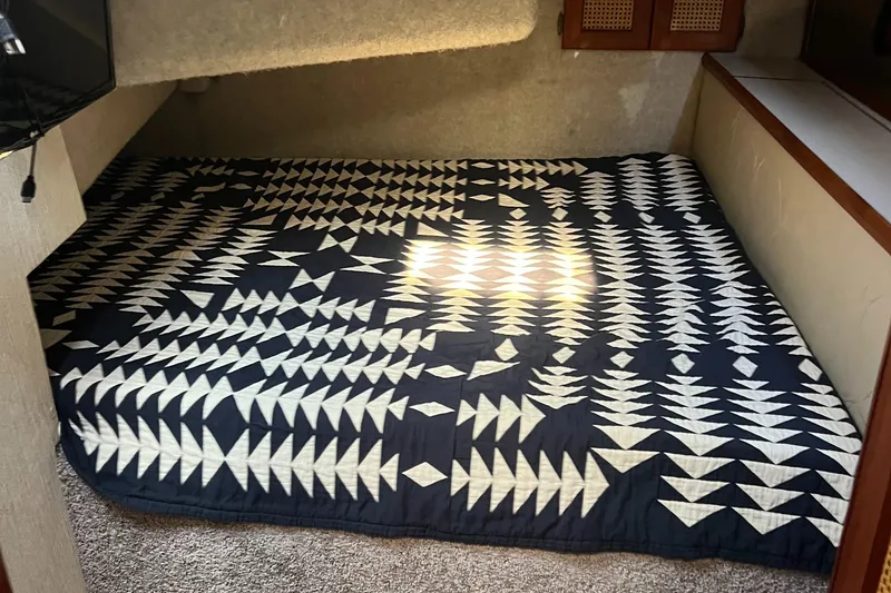 Slide: The Image of 1986 Bayliner 3870 Motoryacht bathroom with sink, mirror, and towel. - 47