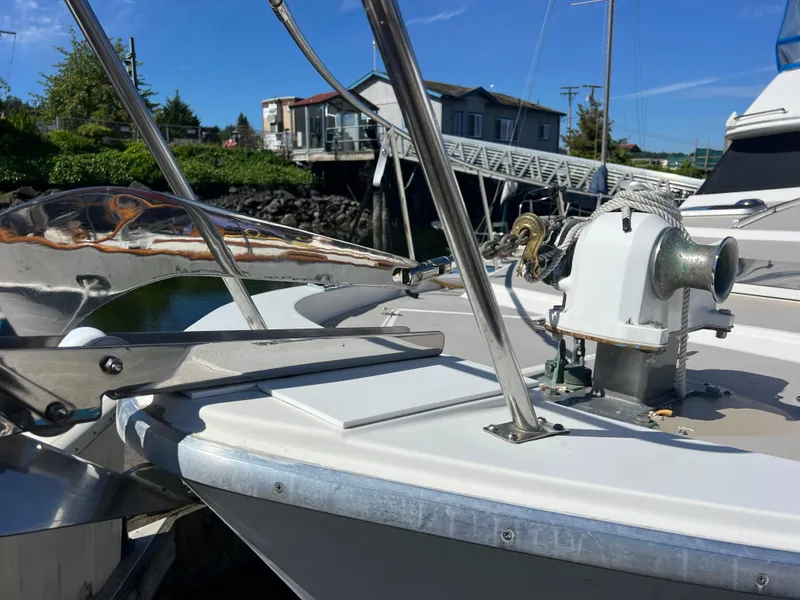 Slide: The Image of 1986 Bayliner 3870 Motoryacht docked, featuring sleek design and spacious deck. - 5