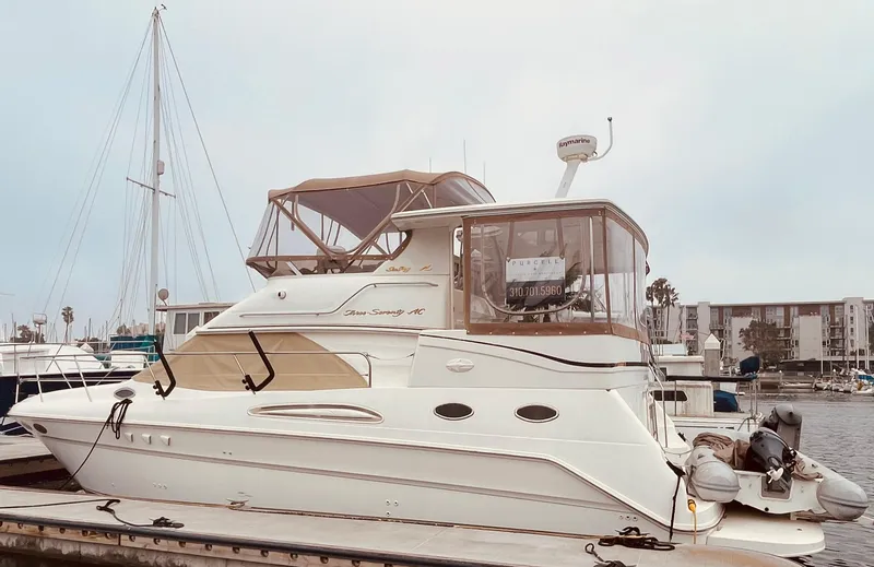 The Image of 1998 Sea Ray 370 Aft Cabin yacht docked at marina, side view. - 0