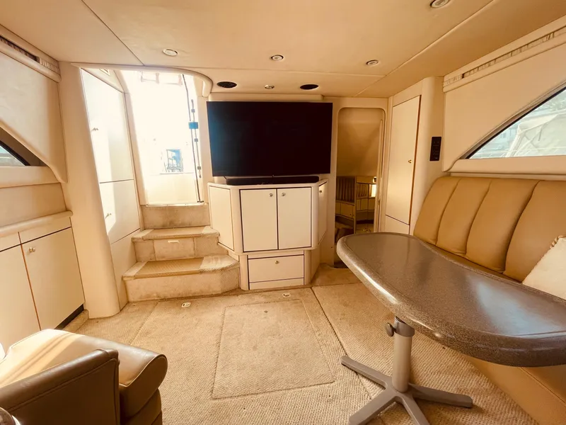 Slide: The Image of 1998 Sea Ray 370 Aft Cabin kitchen with stove, sink, and storage cabinets. - 14