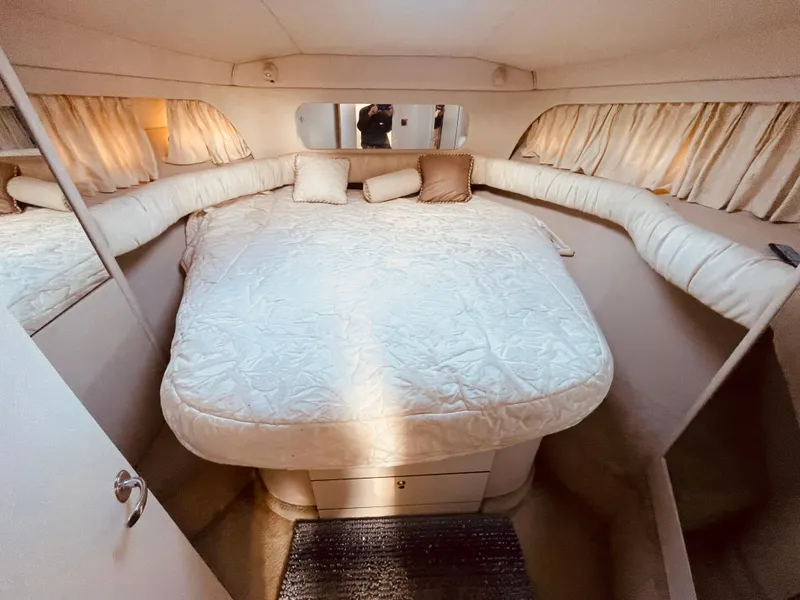Slide: The Image of Luxurious interior of 1998 Sea Ray 370 Aft Cabin yacht with plush seating and elegant design. - 20