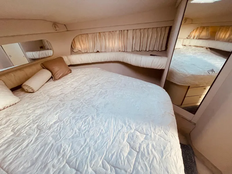 Slide: The Image of 1998 Sea Ray 370 Aft Cabin bathroom with sink, mirror, and toilet. - 22