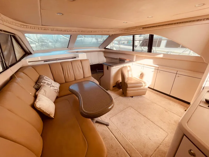 Slide: The Image of 1998 Sea Ray 370 Aft Cabin kitchen with Aloha fridge and beige flooring. - 25