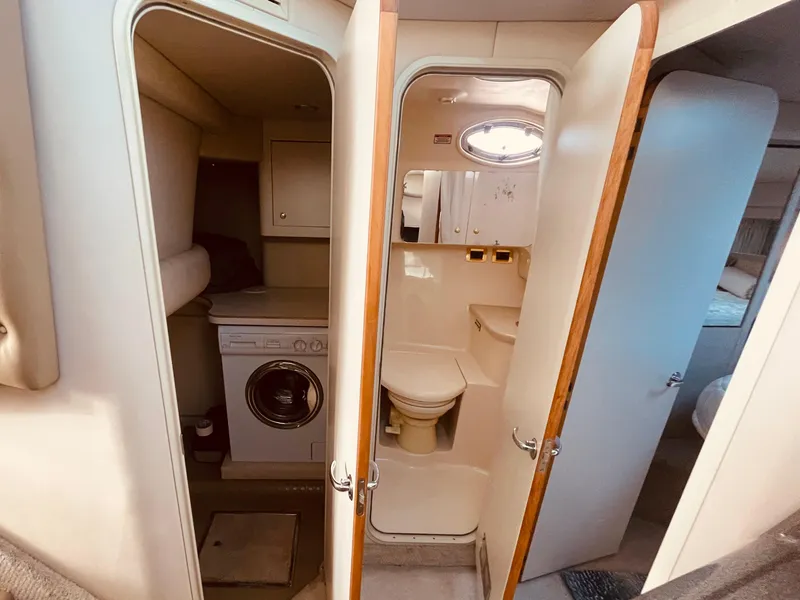 Slide: The Image of 1998 Sea Ray 370 Aft Cabin yacht docked at marina, side view. - 28