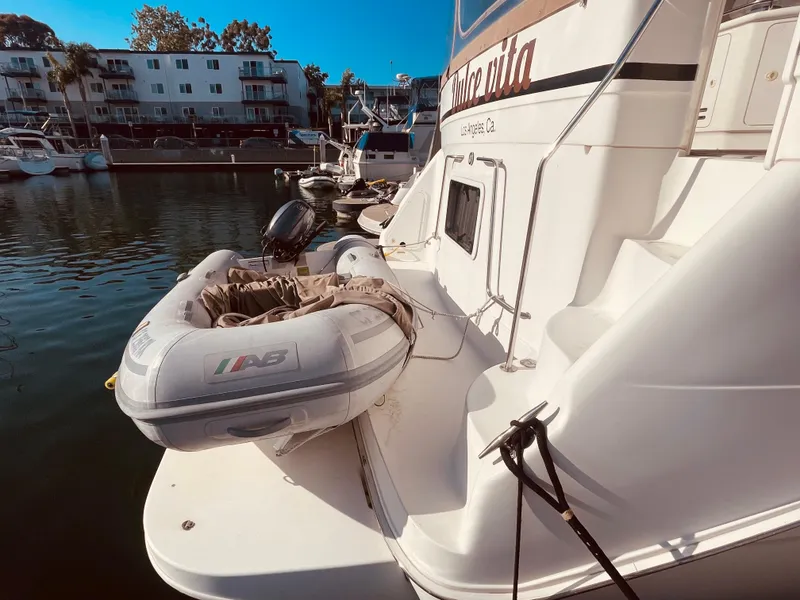 Slide: The Image of Inflatable boat on water near 1998 Sea Ray 370 Aft Cabin yacht. - 4