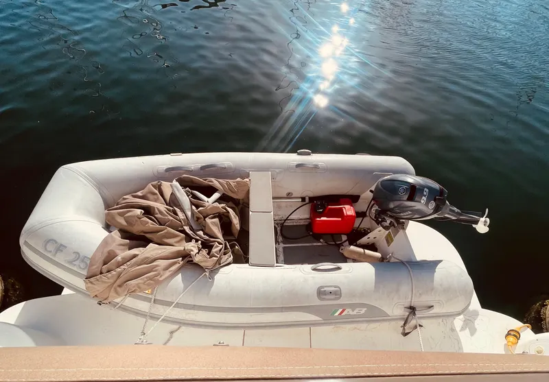 Slide: The Image of 1998 Sea Ray 370 Aft Cabin yacht docked at marina under clear blue sky. - 5