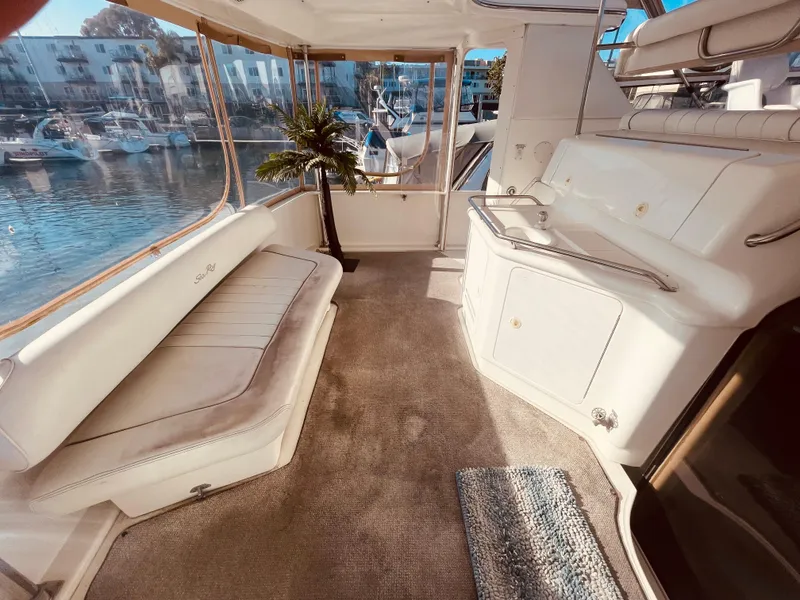 Slide: The Image of 1998 Sea Ray 370 Aft Cabin yacht with inflatable dinghy docked at marina. - 6