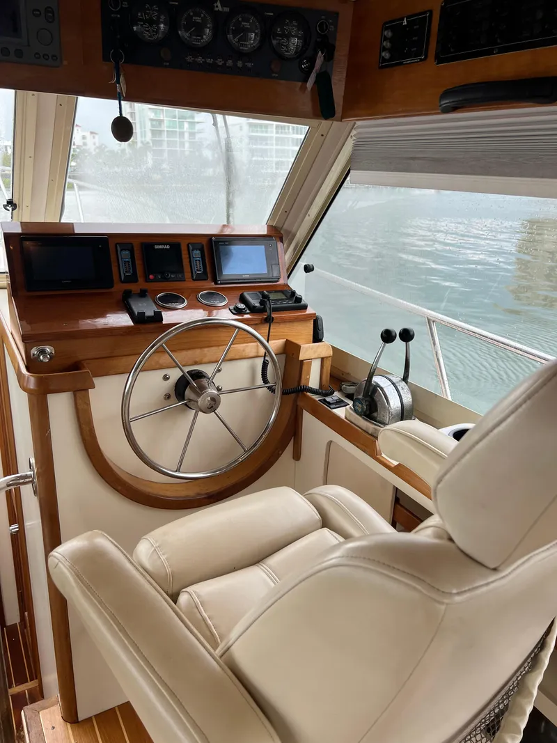 Slide: The Image of 2004 Albin 35 Tournament Express helm with leather seat and navigation controls. - 13