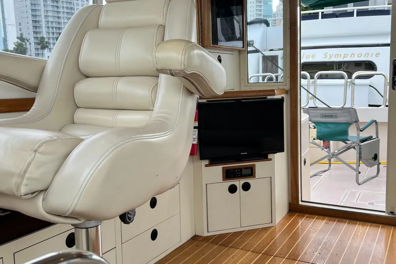 Slide: The Image of Interior of 2004 Albin 35 Tournament Express with leather seating and TV. - 19