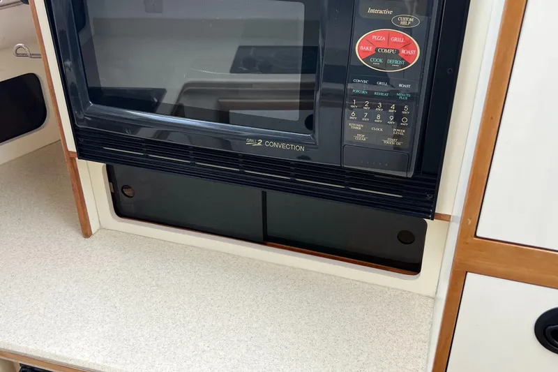 Slide: The Image of Microwave in 2004 Albin 35 Tournament Express boat kitchen area. - 21