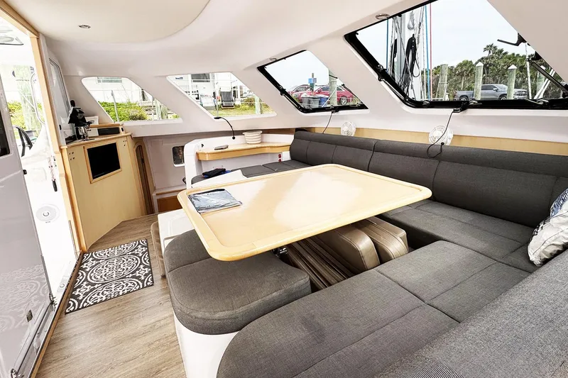 Slide: The Image of Interior of 2019 Seawind 1260 catamaran with modern seating and dining area. - 15