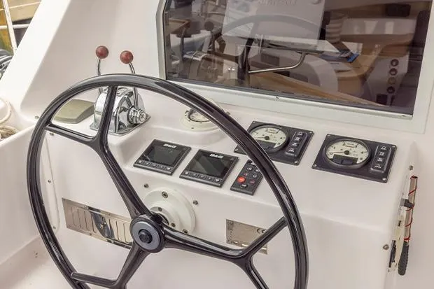 Slide: The Image of Steering wheel and control panel of 2019 Seawind 1260 catamaran. - 6