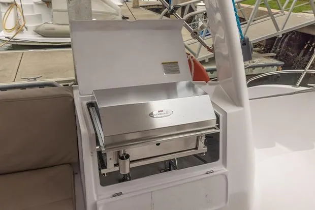 Slide: The Image of Outdoor grill on 2019 Seawind 1260 catamaran deck, docked at marina. - 8