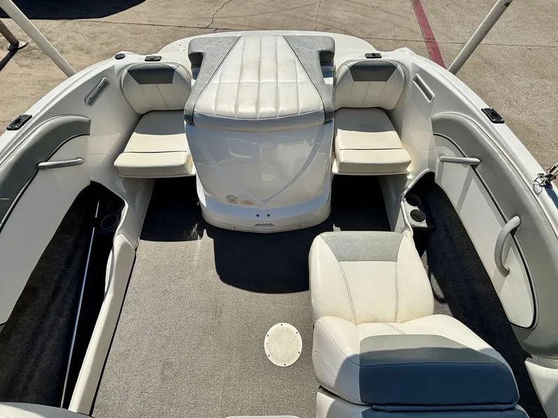 Slide: The Image of 2012 Bayliner 185 Bowrider interior with white seating and spacious layout. - 5