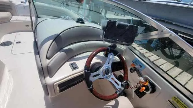 Slide: The Image of 2003 Hurricane 237 Fun Deck boat interior with Yamaha 200 Four Stroke engine, featuring steering wheel. - 16