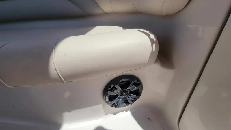 Slide: The Image of Interior of 2003 Hurricane 237 Fun Deck boat with speaker and cushioned seating. - 17