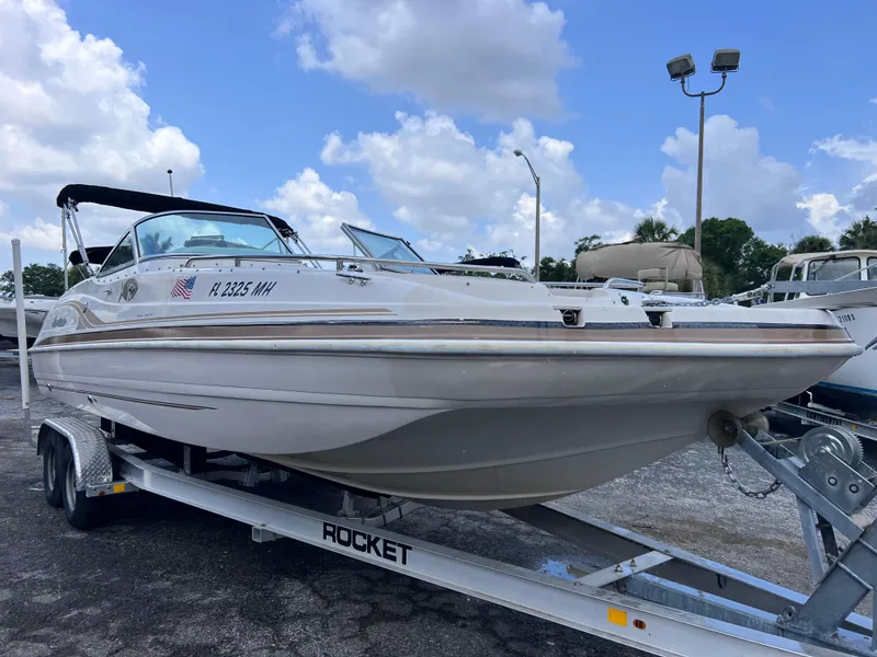 Slide: The Image of 2003 Hurricane 237 Fun Deck boat with Yamaha 200 Four Stroke on trailer. - 2