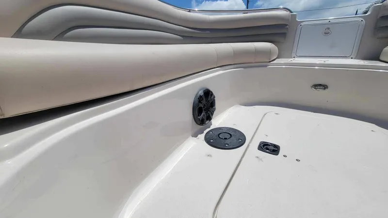Slide: The Image of 2003 Hurricane 237 Fun Deck interior with speaker and seating, featuring Yamaha 200 Four Stroke. - 21