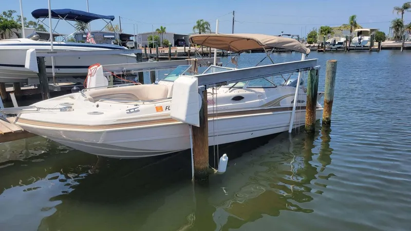 Slide: The Image of 2003 Hurricane 237 Fun Deck boat with Yamaha 200 Four Stroke, docked in marina. - 28
