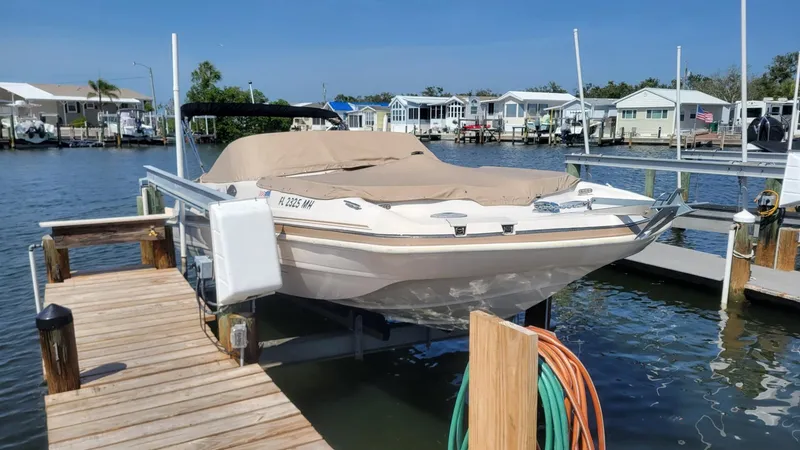 Slide: The Image of 2003 Hurricane 237 Fun Deck boat with Yamaha 200 Four Stroke, docked and covered. - 31