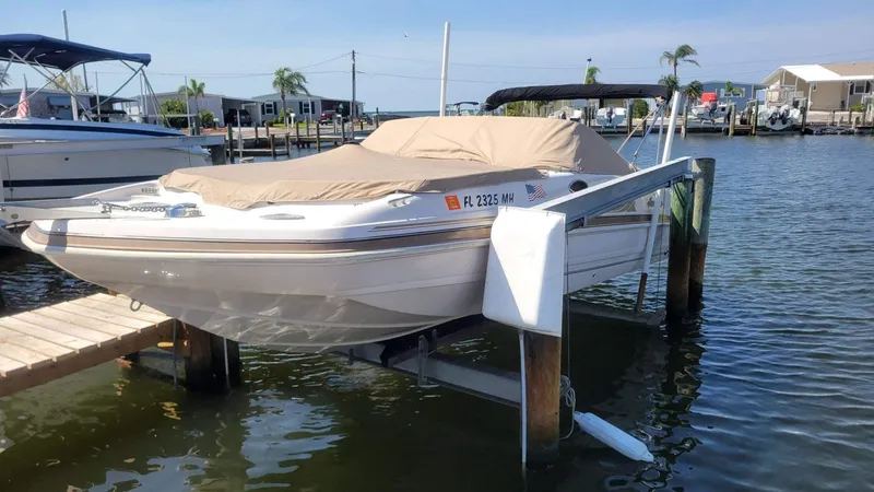 Slide: The Image of 2003 Hurricane 237 Fun Deck boat with Yamaha 200 Four Stroke, docked and covered. - 32