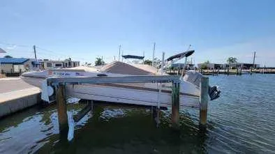 Slide: The Image of 2003 Hurricane 237 Fun Deck boat with Yamaha 200 Four Stroke, docked on a lift. - 33