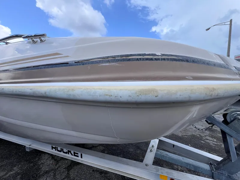 Slide: The Image of 2003 Hurricane 237 Fun Deck boat on trailer, featuring Yamaha 200 Four Stroke engine. - 9