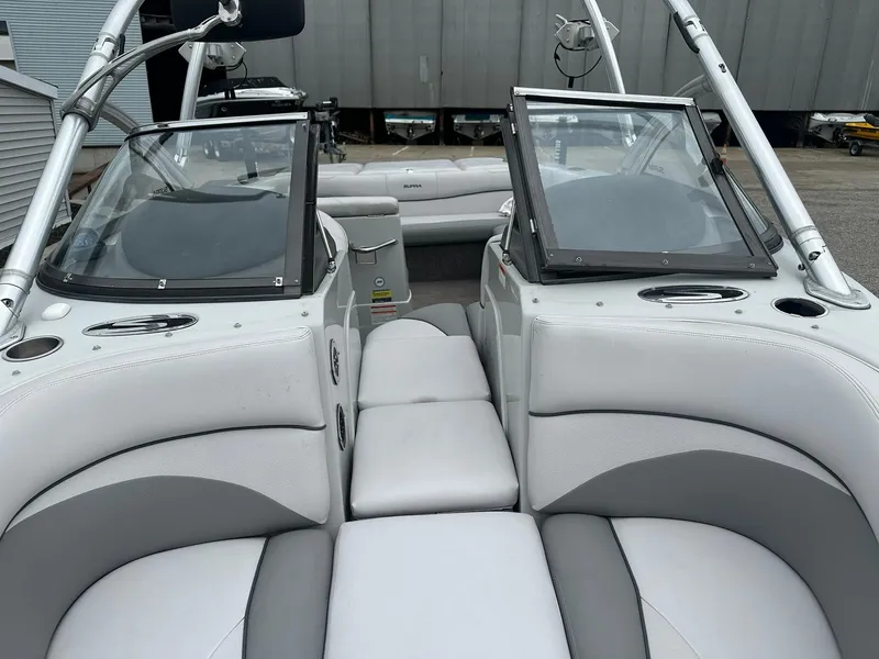 Slide: The Image of 2009 Supra Launch 22 SSV boat interior with white and gray seating. - 14